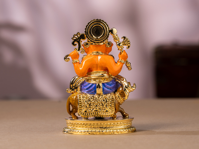 Handmade Enamel gold-plated Brass Ganesh Idol sitting with Mushak. Medium Statue.