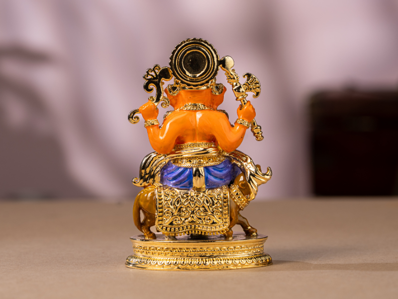 Handmade Enamel gold-plated Brass Ganesh Idol sitting with Mushak. Medium Statue.