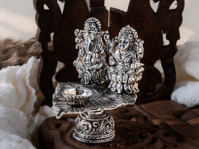 Silver oxidised Brass Lakshmi with Ganesh Diya on Asvaththa Patra with Hand Metal Carving. Medium Diya